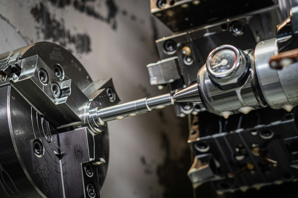 A close up of a CNC machine during manufacturing.